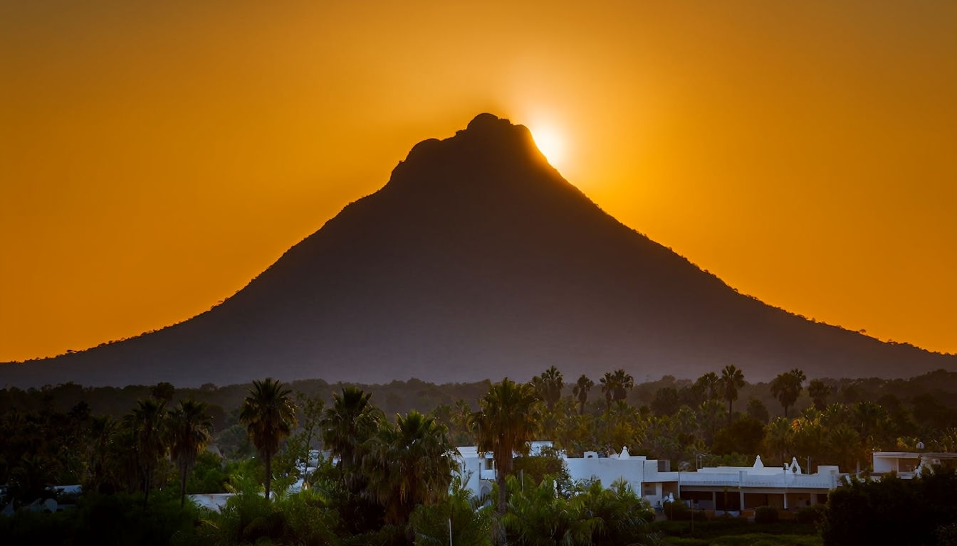 Dramatic Sunset Over Mountain Peak with Lush Foreground Background