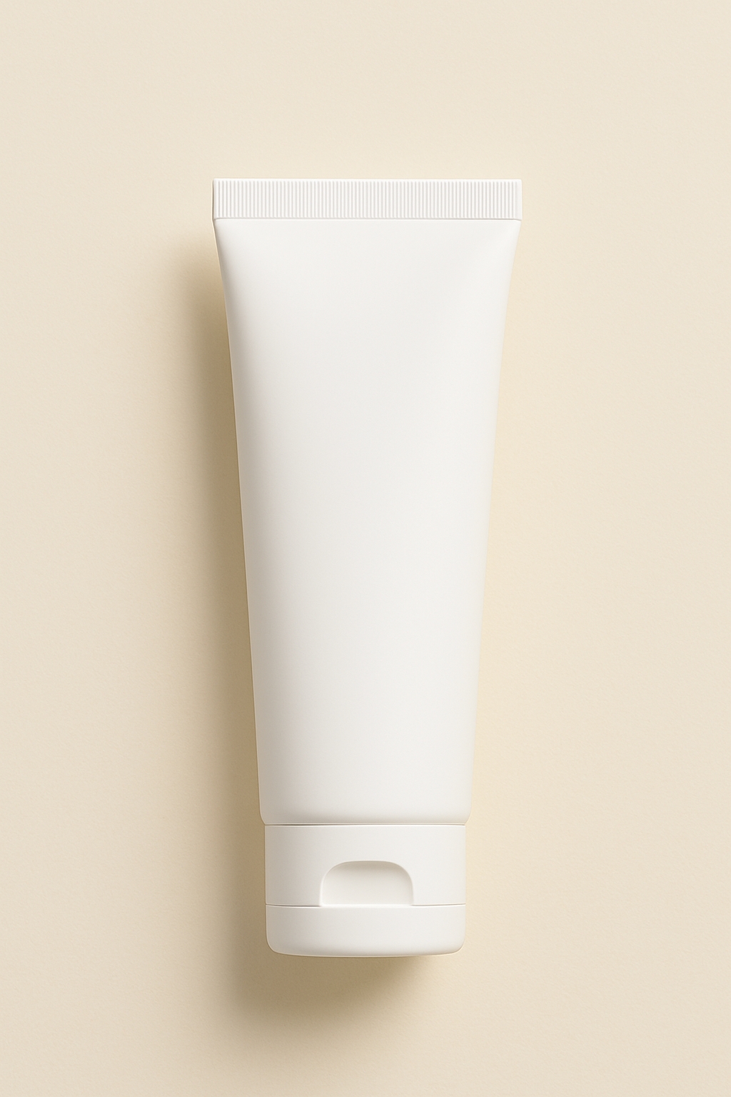Elegant Minimalist Cream Tube Design Against Beige Background Mockup