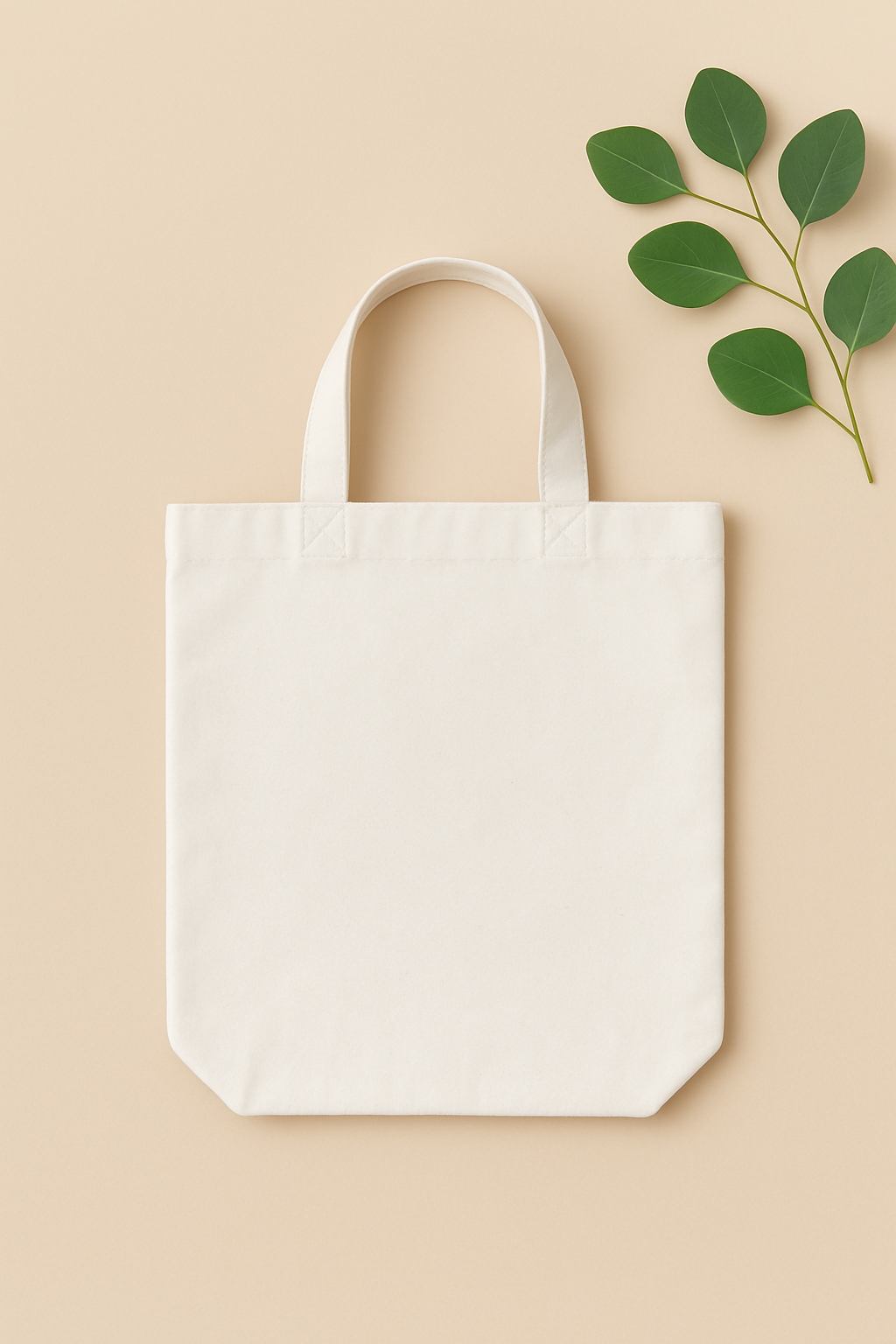Minimalist Off-White Cotton Tote Bag with Green Leaves Mockup