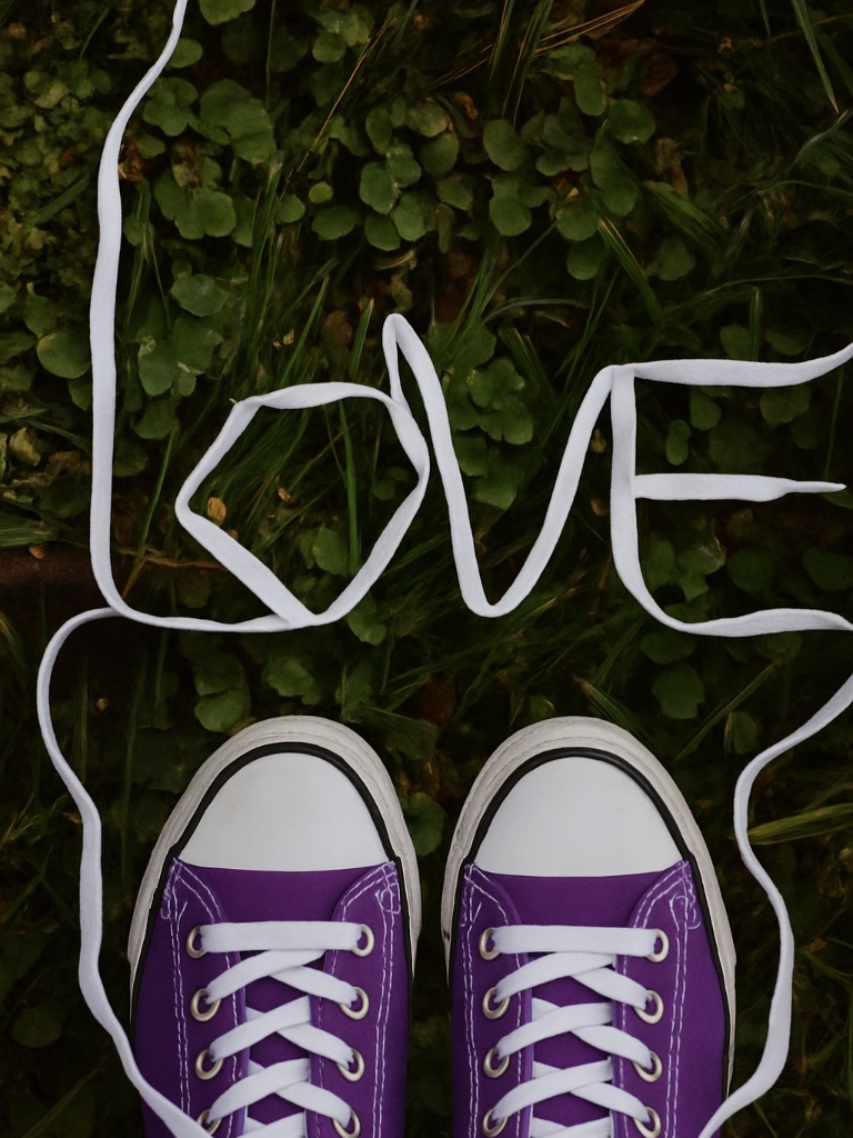 Vibrant Purple Sneakers with LOVE in Green Grass Poster