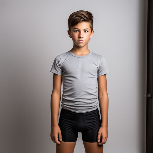 Shirtless 12 year old boy wearing tight fitting stretchy bla by