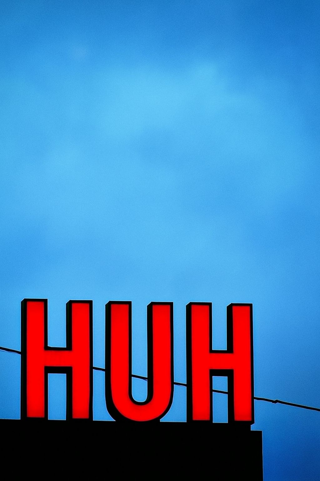 Bright Red Neon 'HUH' Text Minimalist Photography Poster